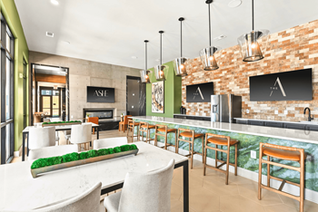 A restaurant with a bar area and a dining table.